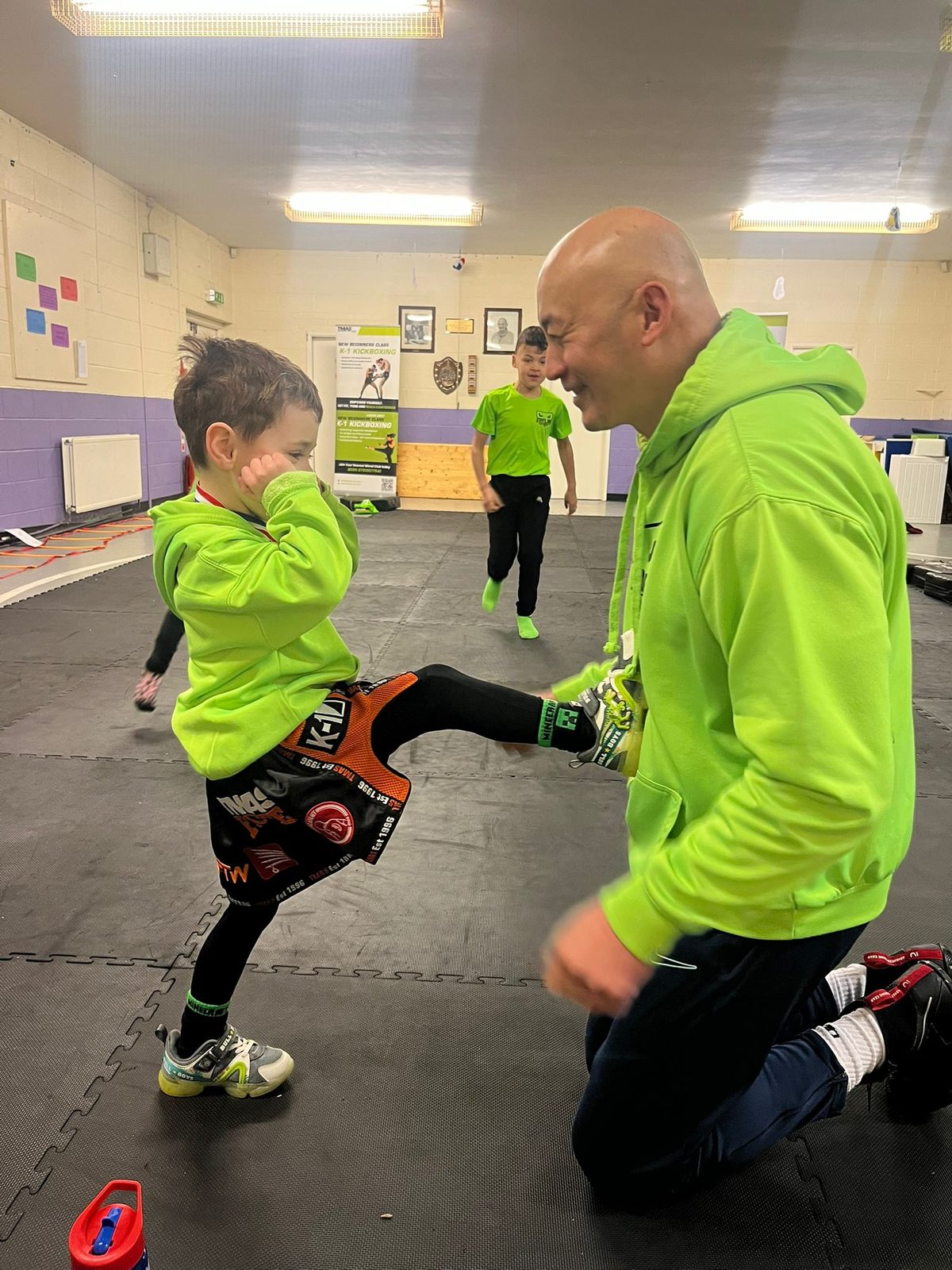 Master Coach Bern Giam coaching a junior martial artist