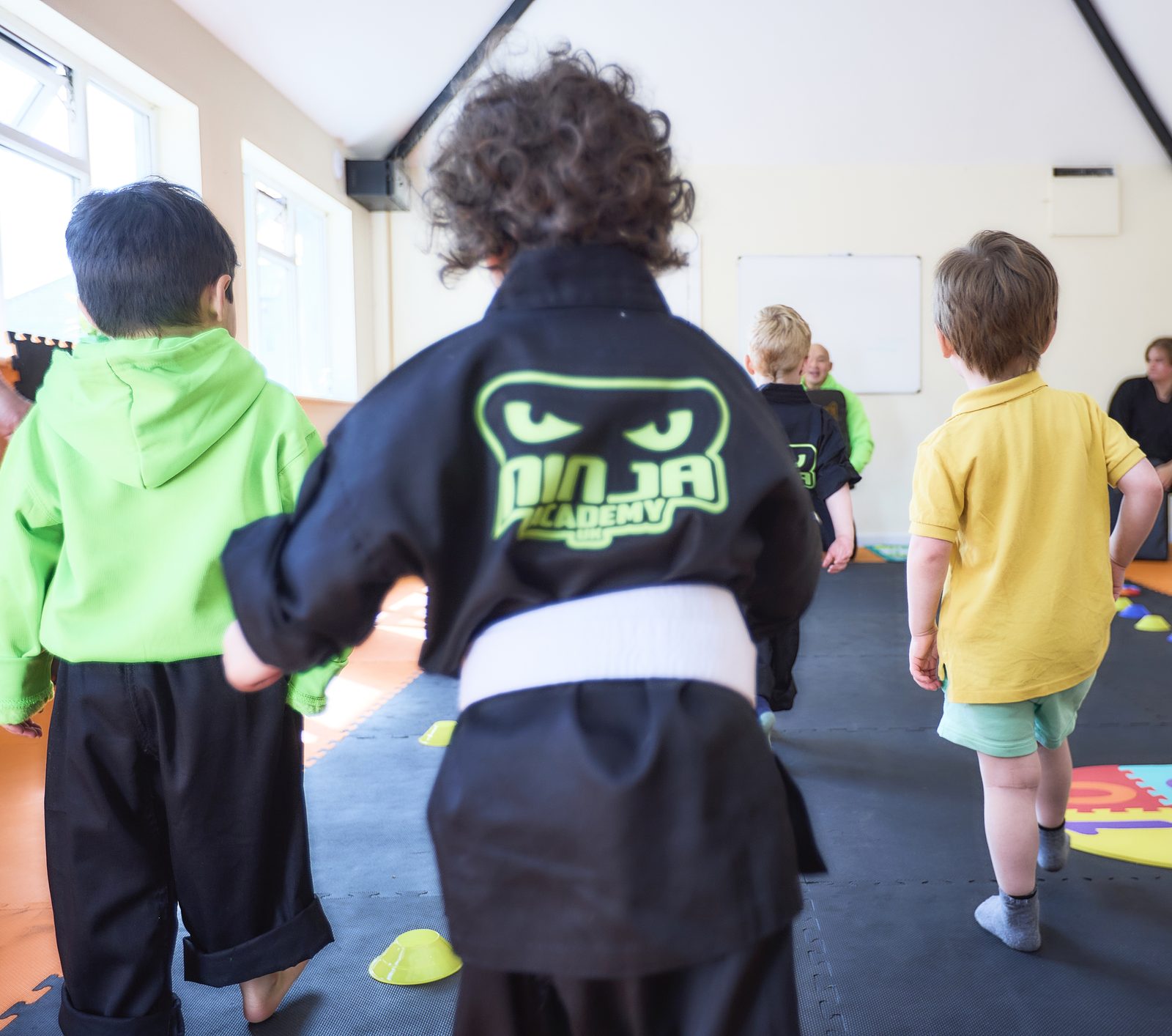 Little Ninjas students listening attentively during martial arts instruction